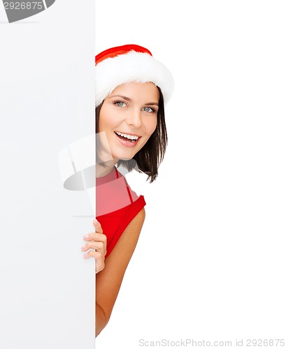 Image of woman in santa helper hat with blank white board