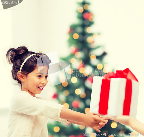 Image of happy child girl with gift box