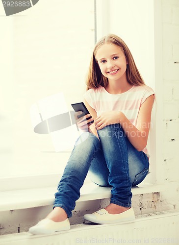 Image of girl with smartphone at school