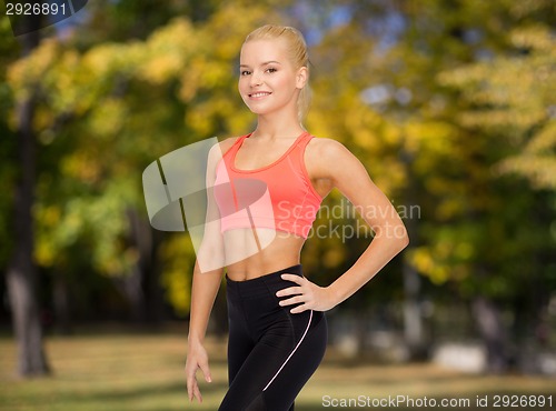 Image of beautiful athletic woman in sportswear