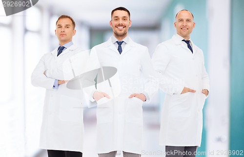 Image of smiling male doctors in white coats