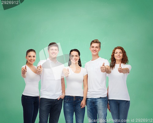 Image of smiling teenagers in t-shirts showing thumbs up