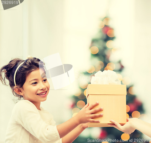 Image of happy child girl with gift box