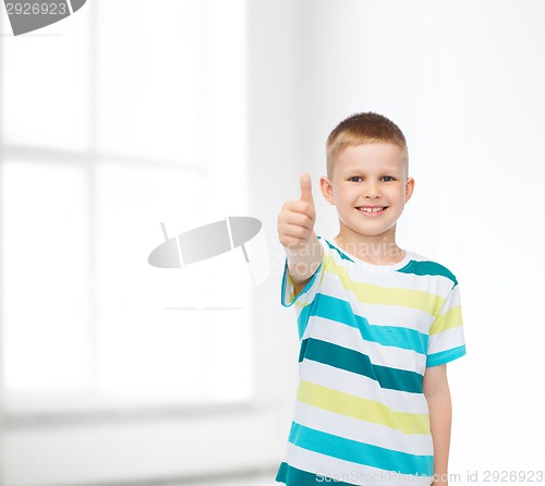 Image of little boy in casual clothes with arms crossed