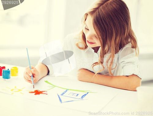 Image of little girl painting picture