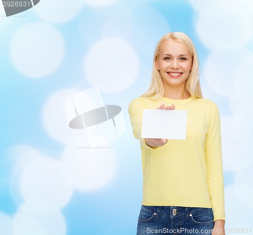 Image of smiling girl with blank business or name card