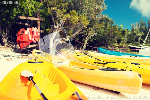 Image of canoes on sandy beach