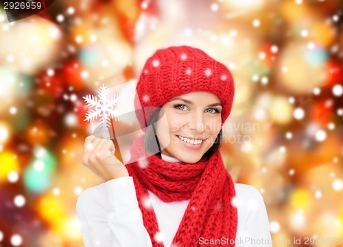 Image of smiling young woman in winter clothes