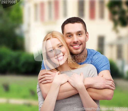 Image of smiling couple hugging