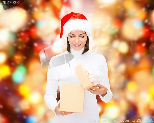 Image of smiling woman in santa helper hat with gift box