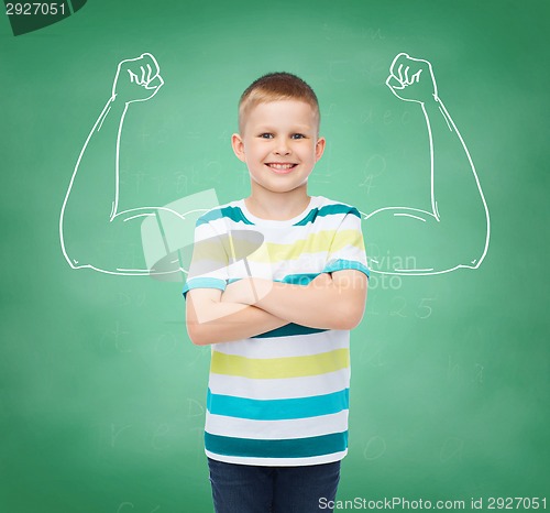 Image of little boy in casual clothes with arms crossed