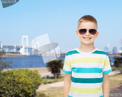 Image of smiling cute little boy in sunglasses