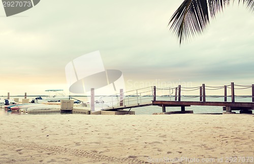 Image of boats moored to pier