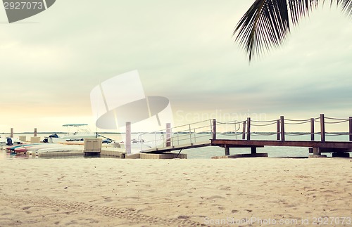 Image of boats moored to pier