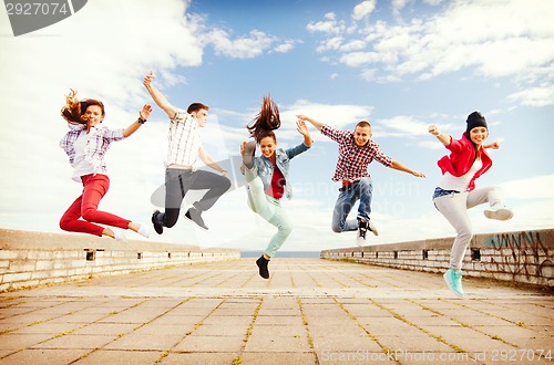 Image of group of teenagers jumping