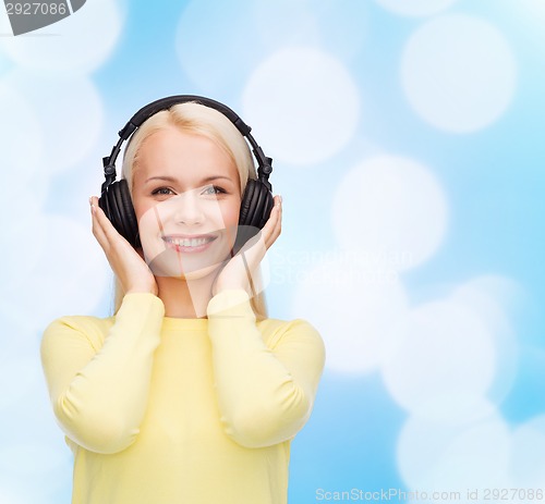 Image of smiling young woman with headphones