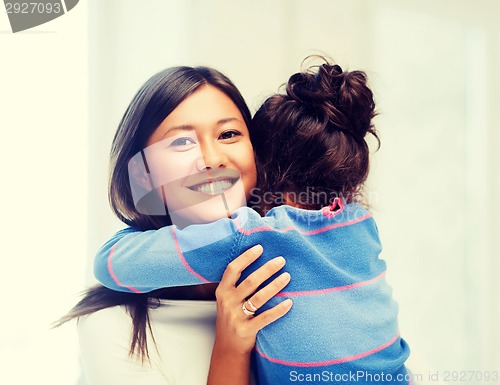 Image of hugging mother and daughter