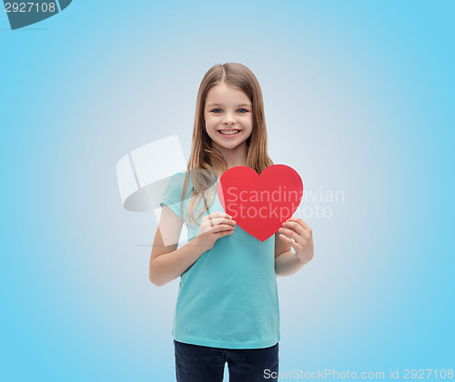 Image of smiling little girl with red heart