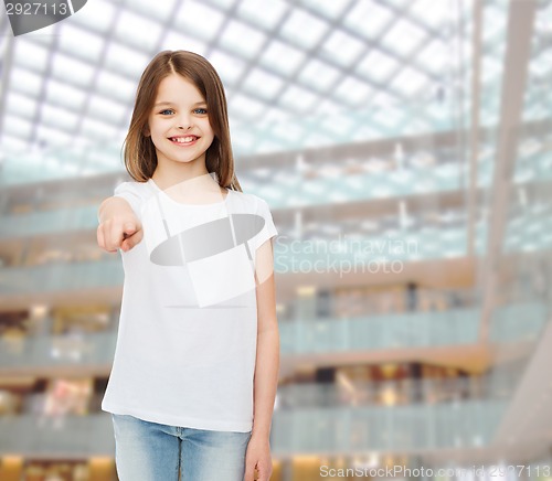 Image of smiling little girl in white blank t-shirt