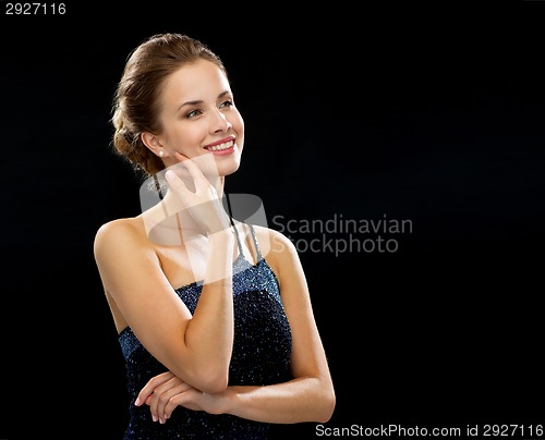 Image of smiling woman in evening dress