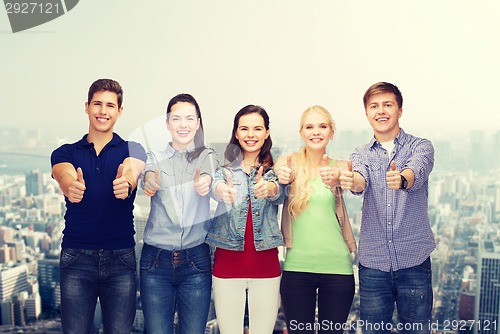 Image of group of smiling students showing thumbs up