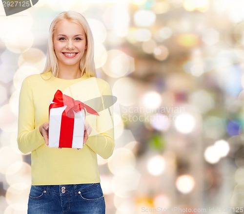 Image of smiling girl with gift box