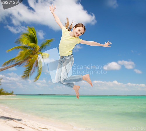 Image of smiling little girl jumping