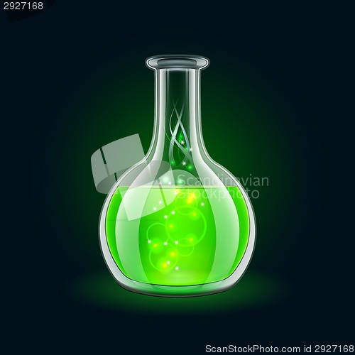 Image of Transparent flask with magic green liquid on black background.