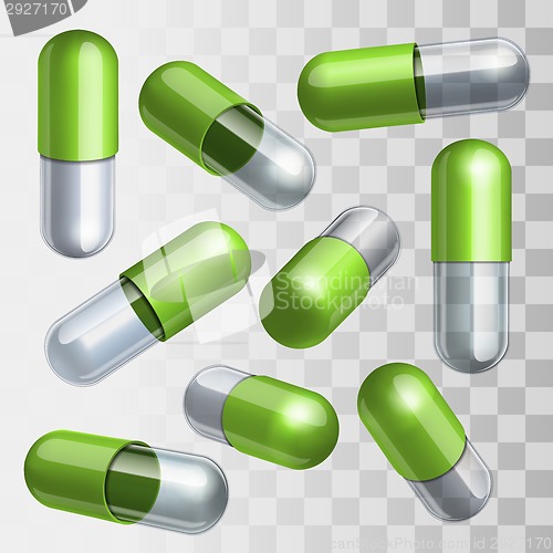 Image of Set of green and transparent medical capsules in different positions