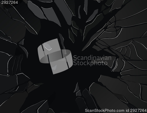 Image of Pieces of sharp shattered glass on black