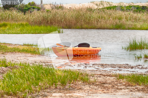 Image of orange kayak on pamlino sound beach 