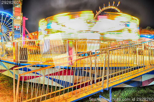 Image of abstract lights of ferry ride at carnival