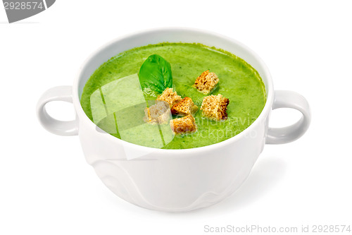 Image of Soup puree with croutons and spinach in bowl