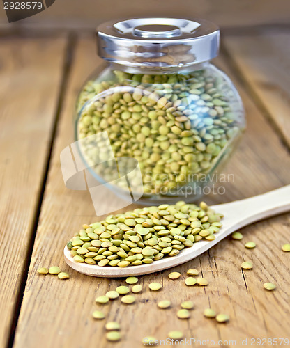 Image of Lentils green in jar and spoon on board
