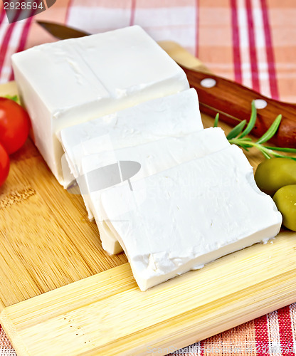 Image of Feta with olives and tomatoes on a red fabric