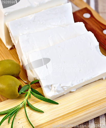 Image of Feta with olives on a brown cloth