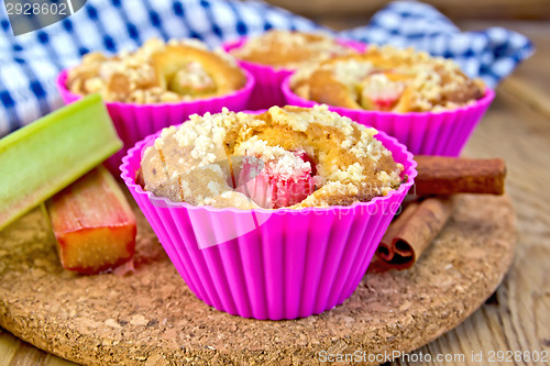 Image of Cupcakes with rhubarb in tins on board