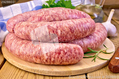 Image of Sausages pork on board with oil