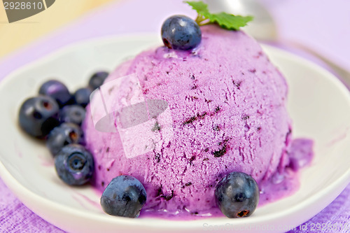 Image of Ice cream blueberry with mint on plate