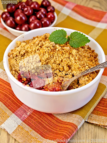 Image of Crumble cherry on napkin and a board