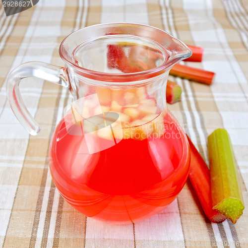 Image of Compote from rhubarb in a jug on tablecloth
