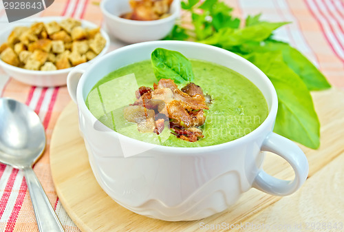 Image of Soup puree with bacon and croutons on fabric