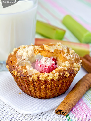 Image of Cupcake with rhubarb and milk on napkin