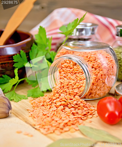 Image of Lentils red in jar with parsley on board