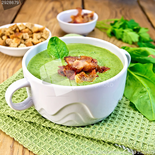 Image of Soup puree with bacon and croutons on board