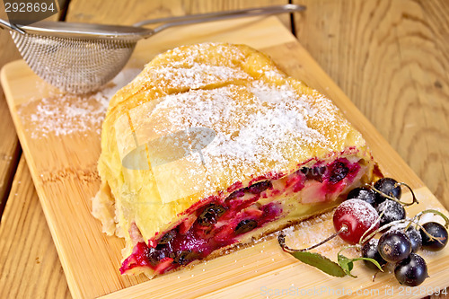 Image of Strudel with black currants on board
