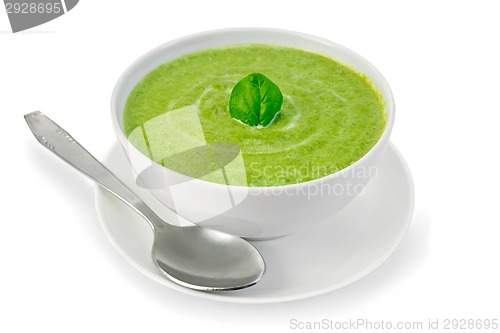 Image of Soup puree with spinach in bowl and spoon