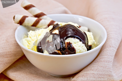 Image of Ice cream vanilla with waffles on napkin
