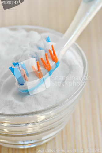 Image of sodium bicarbonate and a toothbrush