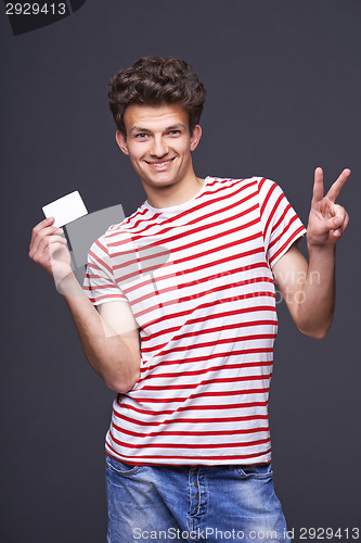 Image of Man showing empty blank paper card sign